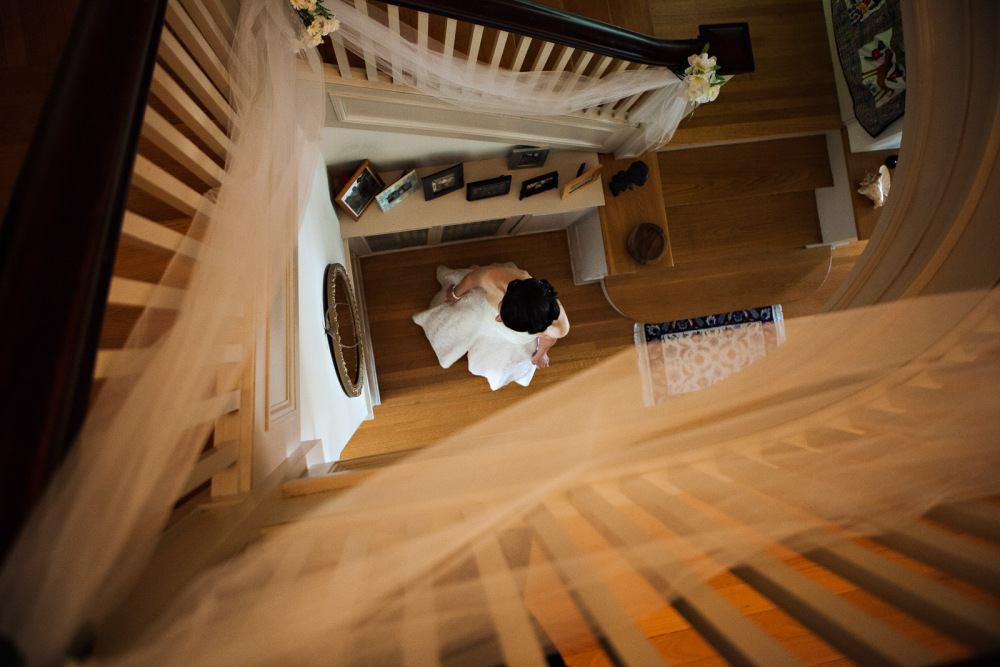 Above the Bride - From the staircase above the bride makes for beautiful wedding photographs in Portland Oregon