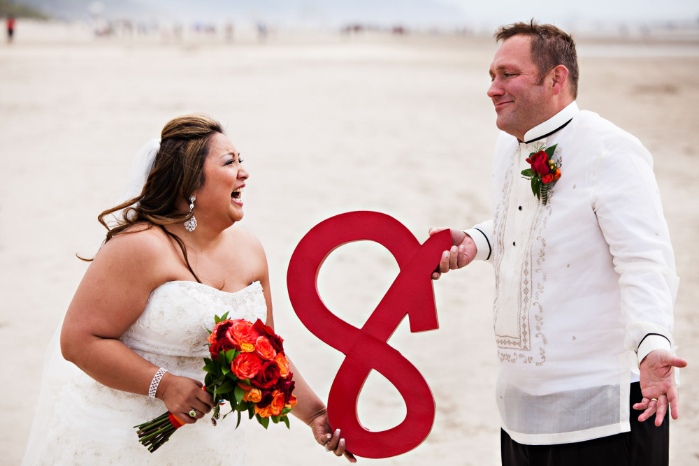 Slightly Confusing - The upside-down ampersand creates a little confusion, but we love to have fun with wedding photography!