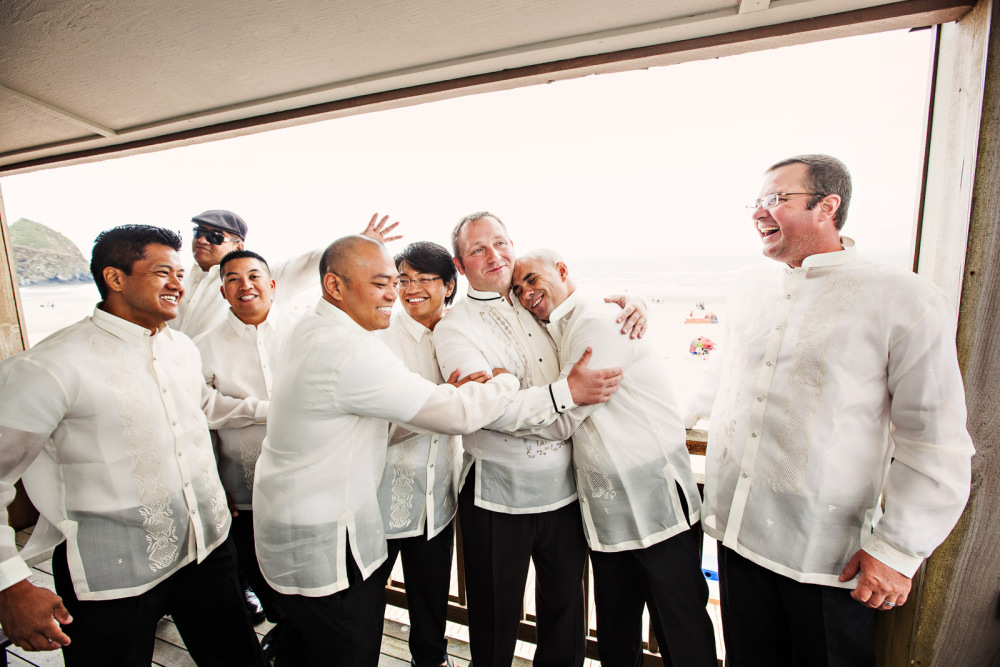Affection from the Groomsmen - Having your friends and family close on the wedding day makes for some great moments.  The groomsmen show affection to the groom at Sandsurf Resort before his wedding