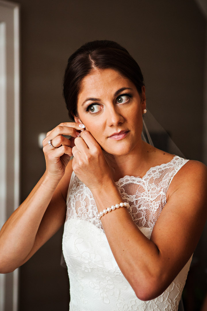 Her Pearl Earings - The bride looks stunning as she puts on her pearl earrings before her wedding ceremony in Corvallis